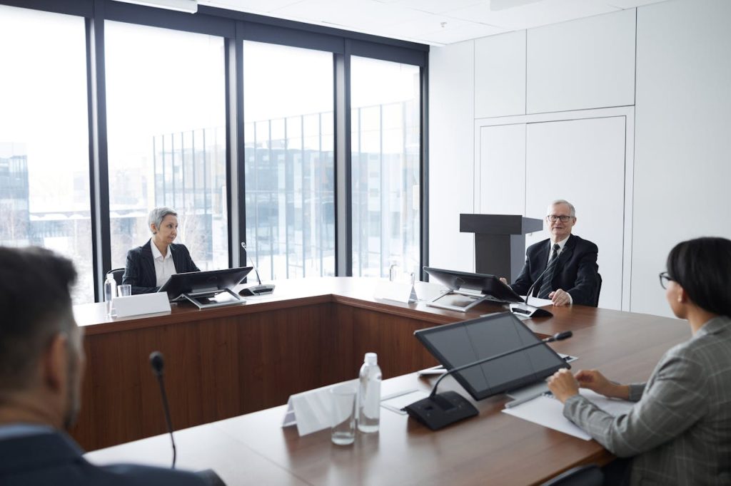 A corporate boardroom meeting overlooking the Conakry port, illustrating the professional setup of a Yes Invest in Guinea client.